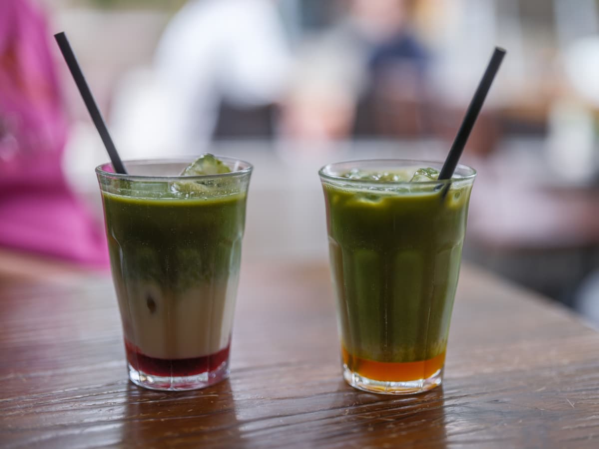 Frozen blended green matcha drink in a tall glass